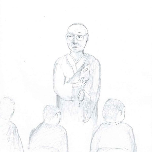 鉛筆による素描。中央に眼鏡をかけた頭髪の薄い年配の男性が立つ。和装風の衣をまとい、左脇に薄い本のようなものを抱え、右手には数珠らしき玉の連なりを提げている。手前には椅子に座った3人の後ろ姿が並び、いずれも丸刈りの頭と上着の背中が見える。右上に縦書きの書き込みと「教誨師」の文字（一部判読困難な書き込みあり）。下部に「2026.4.26」と丸囲みの「7」。